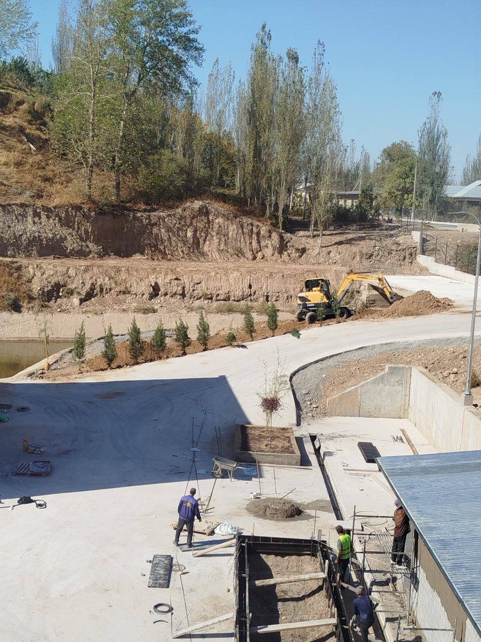 Riverbank earthworks and landscaping beside the restored channel