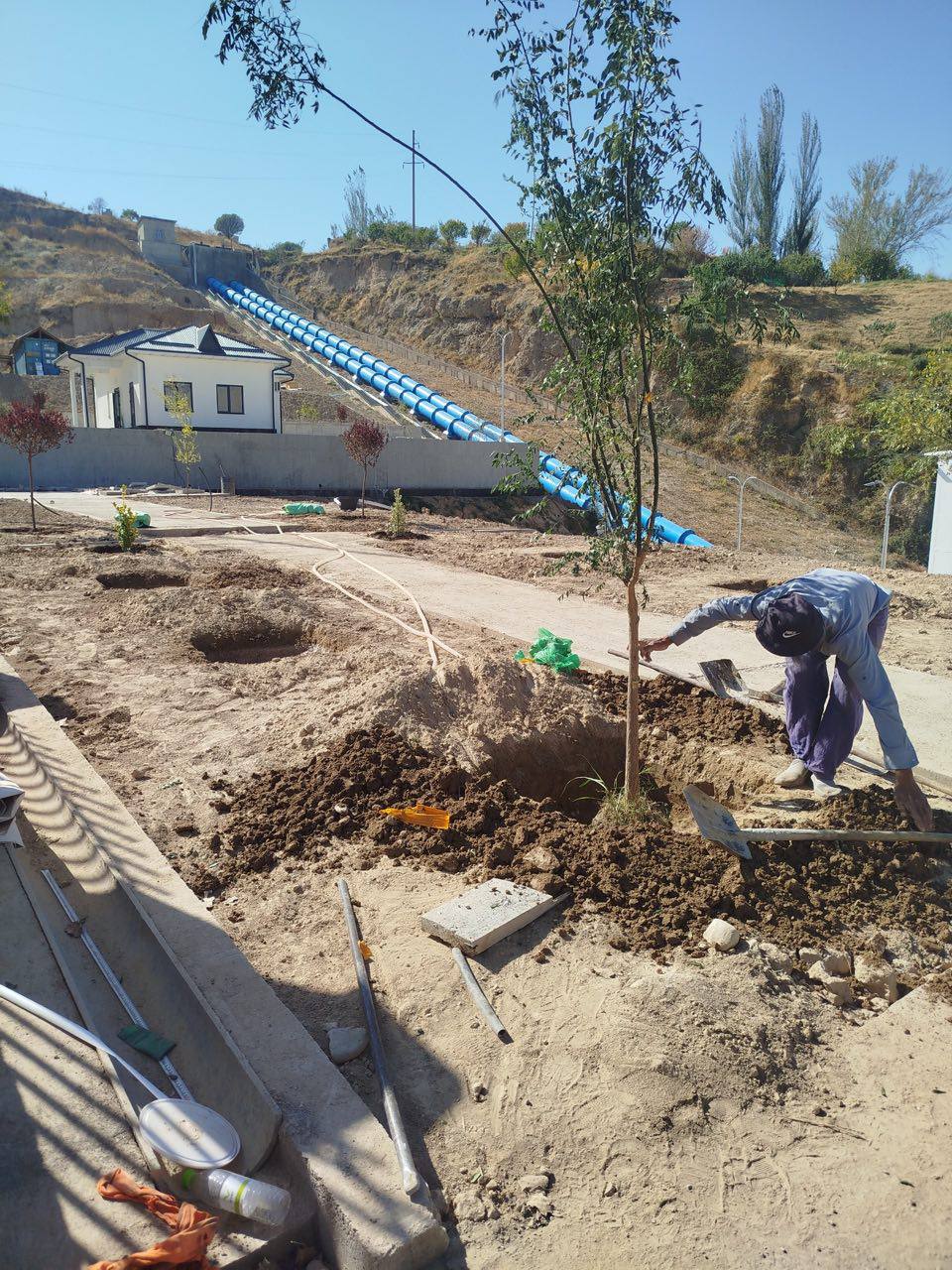 Landscaping works beneath the restored penstock line